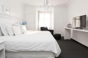 Cama ou camas em um quarto em La Mision Hotel Boutique