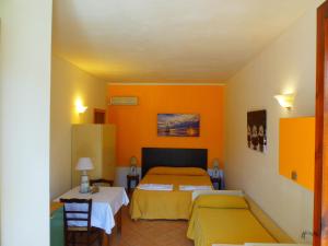 Postel nebo postele na pokoji v ubytování Missipezza Residence a Frassanito + 37 fotografií