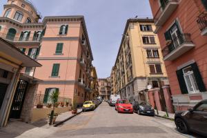 a street with cars parked on the sides of buildings at Bed in Naples in Naples