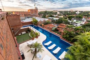 an overhead view of a swimming pool on a building at La Mision Hotel Boutique in Asunción
