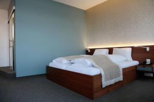 Voodi või voodid majutusasutuse Hotel Engel am Bahnhof toas