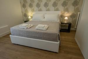 Posteľ alebo postele v izbe v ubytovaní Suite Pinturicchio