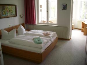 Postel nebo postele na pokoji v ubytování Hotel Nordlicht