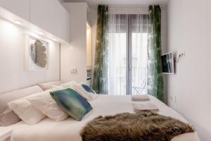 Postel nebo postele na pokoji v ubytování Catedral Boutique Studio