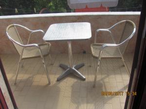 two chairs and a table on a patio at Magdalini Studio in Anaxos +39 photos