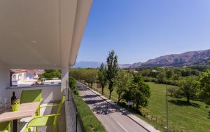 a view from the balcony of a house with a road at Apartment's Đordić in Baška