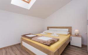 Posteľ alebo postele v izbe v ubytovaní Apartments Đordić