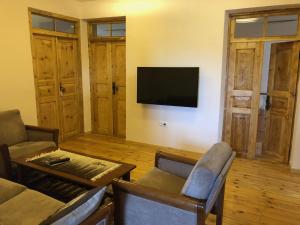 A television and/or entertainment centre at Wings of Tatev Private Villa