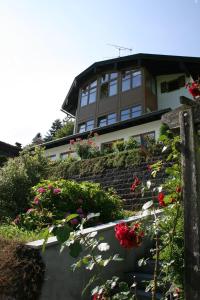 a building with a bunch of flowers in front of it at Haus Bergfrieden in Berchtesgaden
