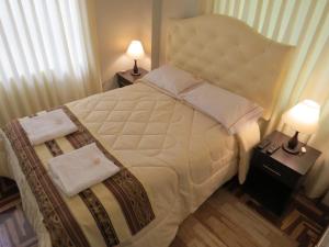 Een bed of bedden in een kamer bij Apartamento Familiar QUEWE