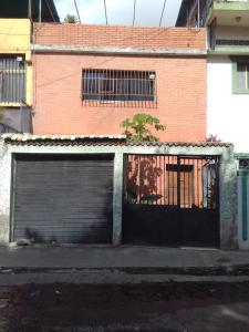 a building with two garage doors in front of it at Candida in Caracas