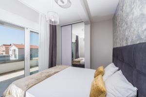Łóżko lub łóżka w pokoju w obiekcie Luxury Apartments Marija