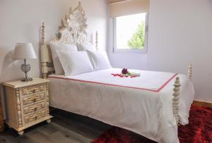 Postel nebo postele na pokoji v ubytování Casa do Azevinho - Grupo Casas Vale do Lima