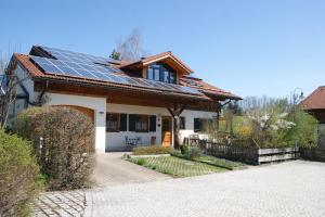 a house with solar panels on the roof at Landhaus Lex in Füssen