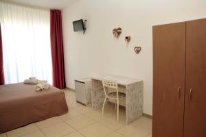 Postel nebo postele na pokoji v ubytování Hotel La Punta
