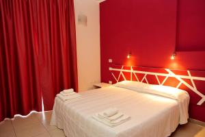 Postel nebo postele na pokoji v ubytování Hotel La Punta
