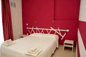 Postel nebo postele na pokoji v ubytování Hotel La Punta