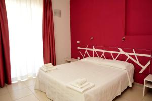 Postel nebo postele na pokoji v ubytování Hotel La Punta