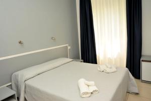 Postel nebo postele na pokoji v ubytování Hotel La Punta