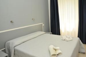 Postel nebo postele na pokoji v ubytování Hotel La Punta