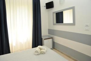 Postel nebo postele na pokoji v ubytování Hotel La Punta