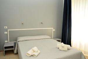 Postel nebo postele na pokoji v ubytování Hotel La Punta