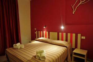 Postel nebo postele na pokoji v ubytování Hotel La Punta