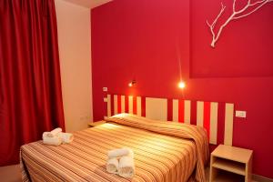 Postel nebo postele na pokoji v ubytování Hotel La Punta