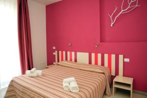Postel nebo postele na pokoji v ubytování Hotel La Punta