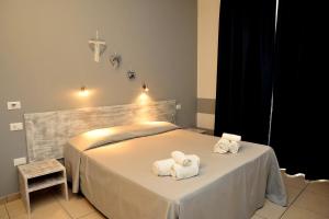 Postel nebo postele na pokoji v ubytování Hotel La Punta