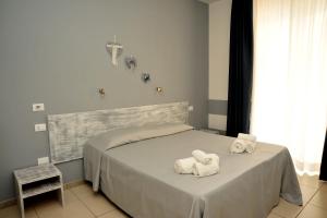 Postel nebo postele na pokoji v ubytování Hotel La Punta