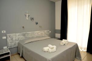 Postel nebo postele na pokoji v ubytování Hotel La Punta