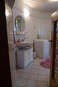 a bathroom with a sink and a mirror at Jocklerturm in Sulzfeld am Main