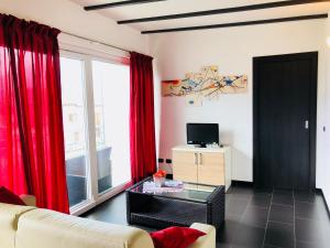 TV a/nebo společenská místnost v ubytování Residence Windsurf