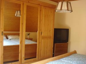 a bedroom with two bunk beds and a tv at Ferienwohnung Lydia in Traben-Trarbach