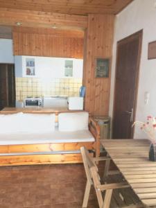 a room with a bed and a chair in it at Villa Nelly by the sea in Néa Koróni