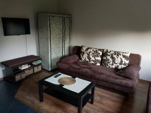 a living room with a couch and a table at Kwatera prywatna in Augustów