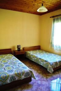 Un pat sau paturi într-o cameră la Ktima Elia