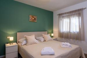 Posteľ alebo postele v izbe v ubytovaní Apartmani Marko i Ana