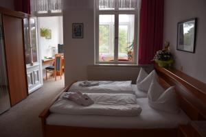 Postel nebo postele na pokoji v ubytování Hotel Nordlicht