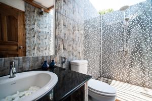a bathroom with a sink and a toilet and a shower at Holiday Cottage Thoddoo, Maldives in Thoddoo +82 photos