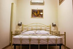 A bed or beds in a room at Ricciolandia Suites