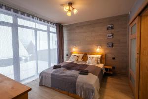 Posteľ alebo postele v izbe v ubytovaní Domki Tatrzański Ogród Regional Houses Zakopane