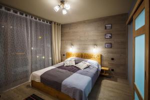 Posteľ alebo postele v izbe v ubytovaní Domki Tatrzański Ogród Regional Houses Zakopane