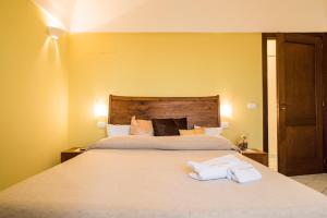 Postel nebo postele na pokoji v ubytování Dammusi Sotto le Stelle