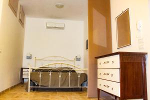 A bed or beds in a room at Ricciolandia Suites
