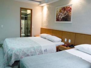 Posteľ alebo postele v izbe v ubytovaní Hotel Copamar