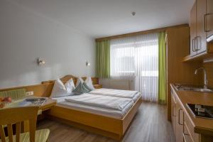 A bed or beds in a room at Ferienhaus Resi & Obermoser