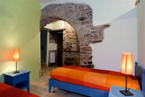 Postel nebo postele na pokoji v ubytování B&B La Dimora del Contadino