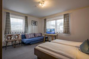 A bed or beds in a room at Ferienhaus Resi & Obermoser
